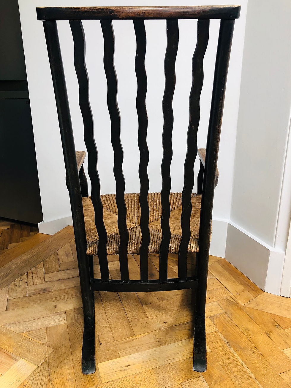 Thumbnail: Arts and Crafts wavy back low rocking chair with rush seat