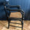 Thumbnail: Regency style ebonised and gilt decorated cane seat bar back elbow chair
