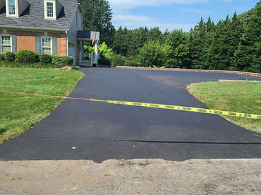 Sleek asphalt paving providing a modern look to the property.