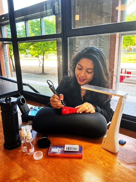 GTA Toronto Calligrapher Engraver Bottle Painter Ishaana M Cherian The Doodler Scribbler Engraving on-site luxury brand Carolina Herrera Perfume