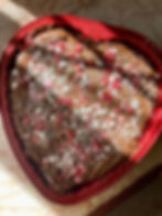 caprese cake in a red heart container with sprinkles