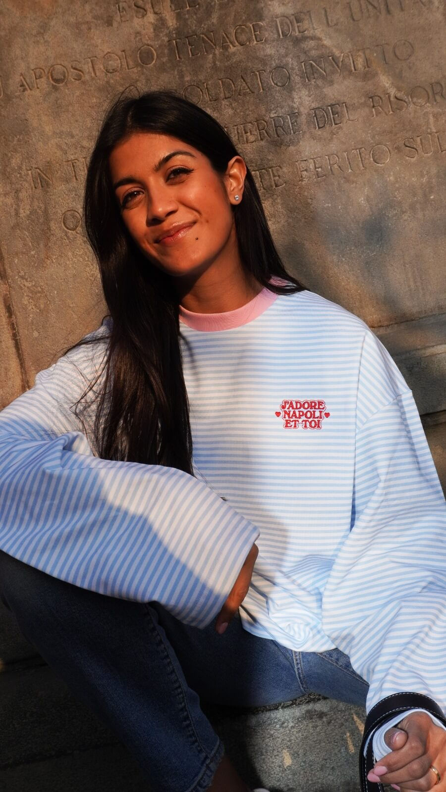 Amby smiling in a J'Adore Napoli shirt