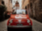 Ambika enjoys a ride in a Fiat 500 in an Italian