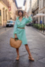Amby poses in a shirt dress in florence
