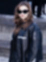 A girl walks in Paris in a black bomber jacket