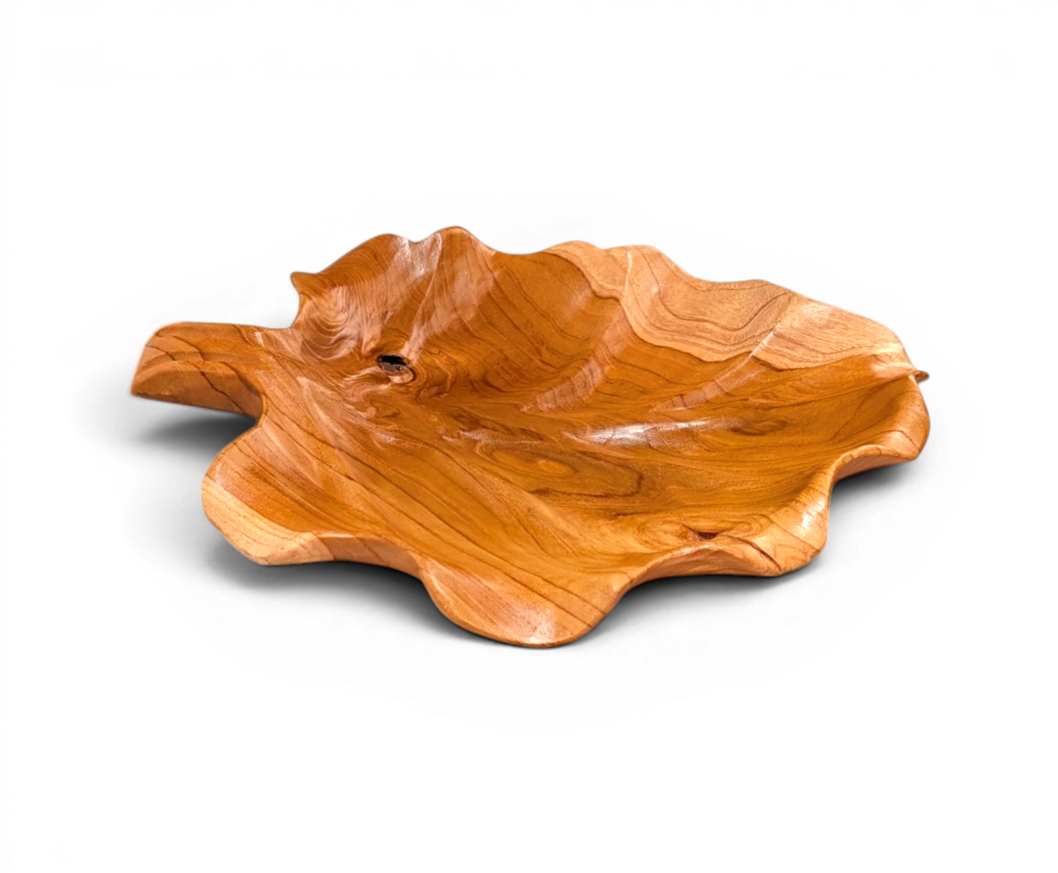 Hand carved Bali teak fan leaf serving tray with flowing golden wood grain
