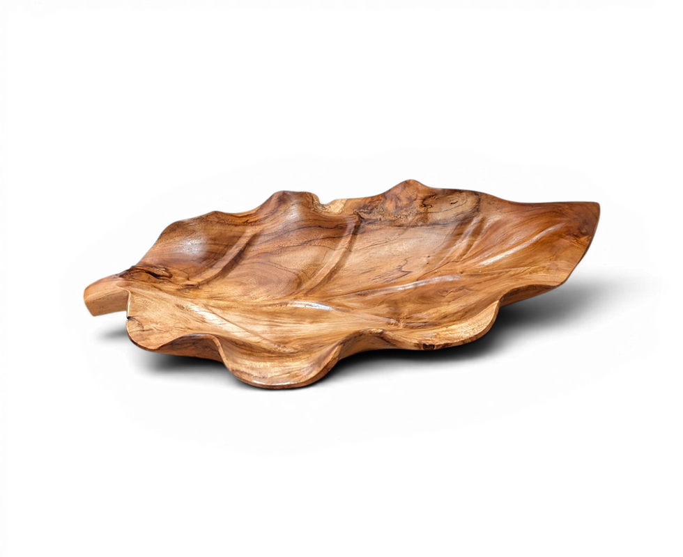 Hand-carved teakwood leaf platter crafted by artisans in Bali.