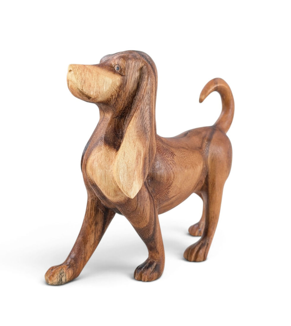 Teakwood dog statue with carved canine features and natural wood grain