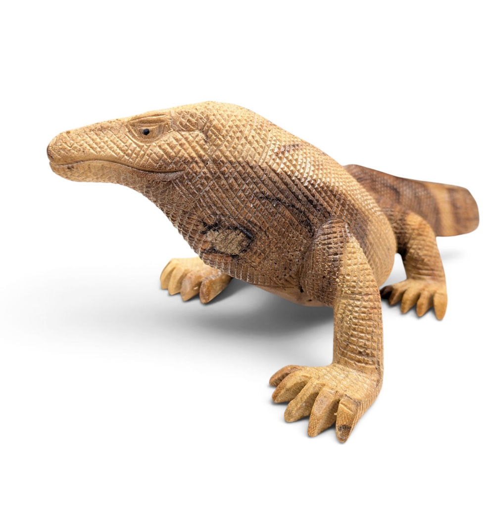 Hand-carved teak Komodo dragon statue made by artisans in Bali