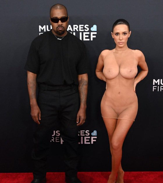 Kanye with Kim wearing the Emperor's New Clothes...