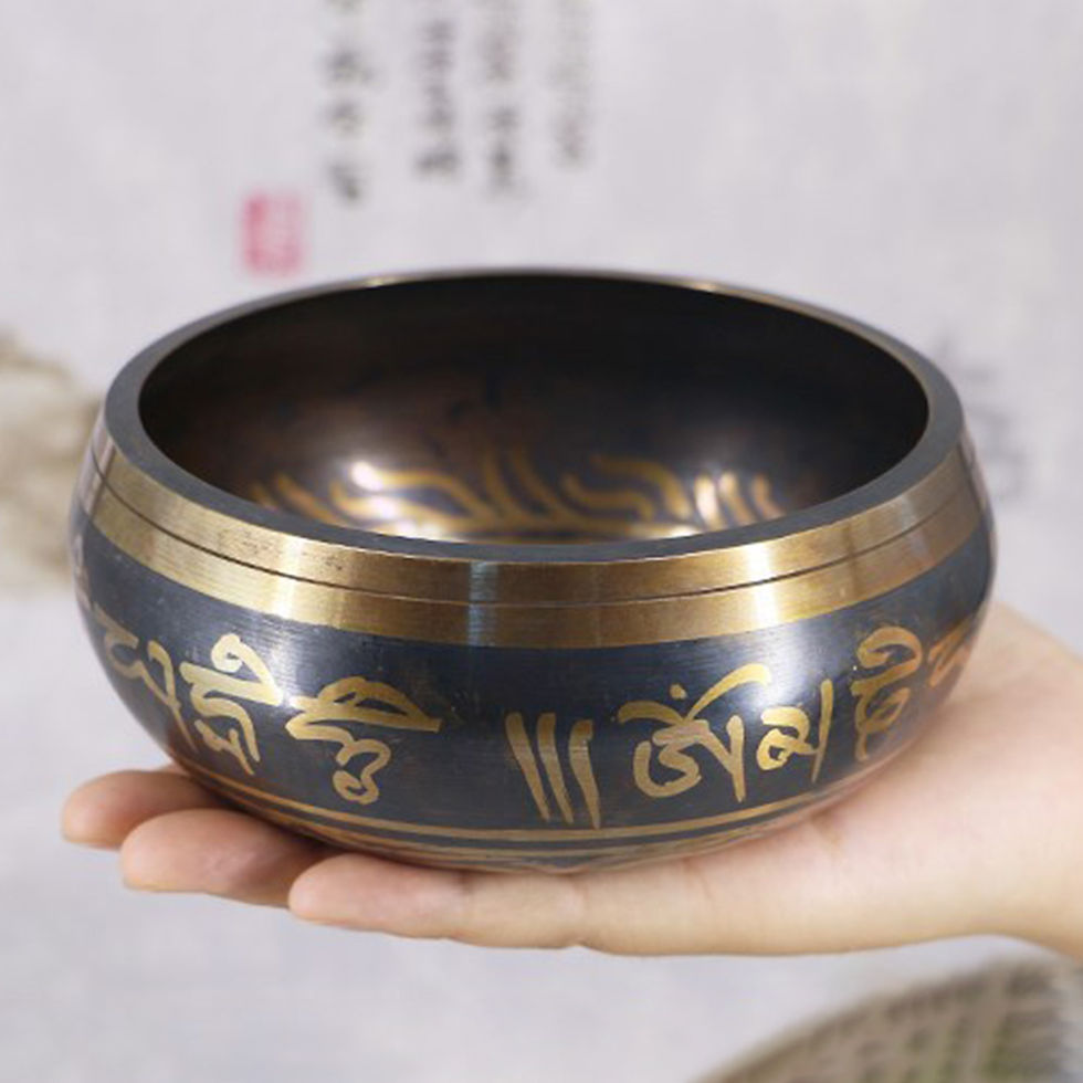 Thumbnail: Tibetan Singing Bowl resting on a palm, featuring gold mantra engravings, ideal for mindfulness, sound therapy, and meditate