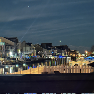 A mysterious entity appears in the bottom right corner of three consecutive photos, taken on February 10, 2025, alongside an orb.