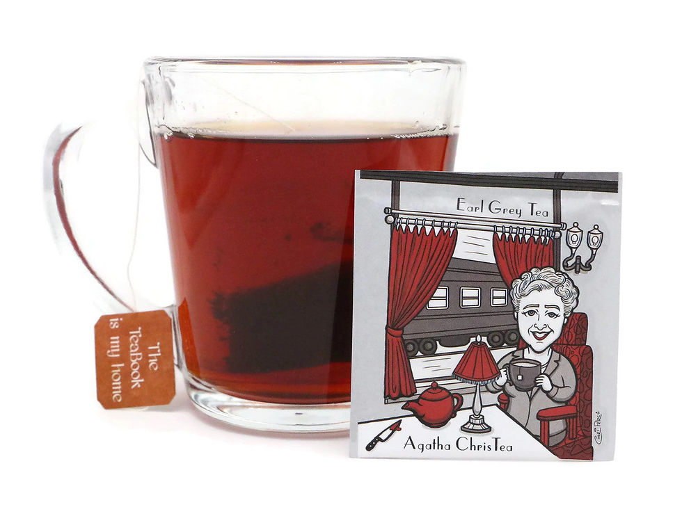 Thumbnail: Dark red tea in a glass mug with a Ten VarieTEA A pack featuring a famous author
