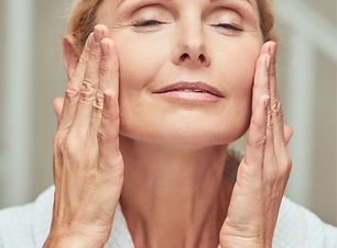 happy-middle-aged-caucasian-woman-making-facial-massage_edited.png