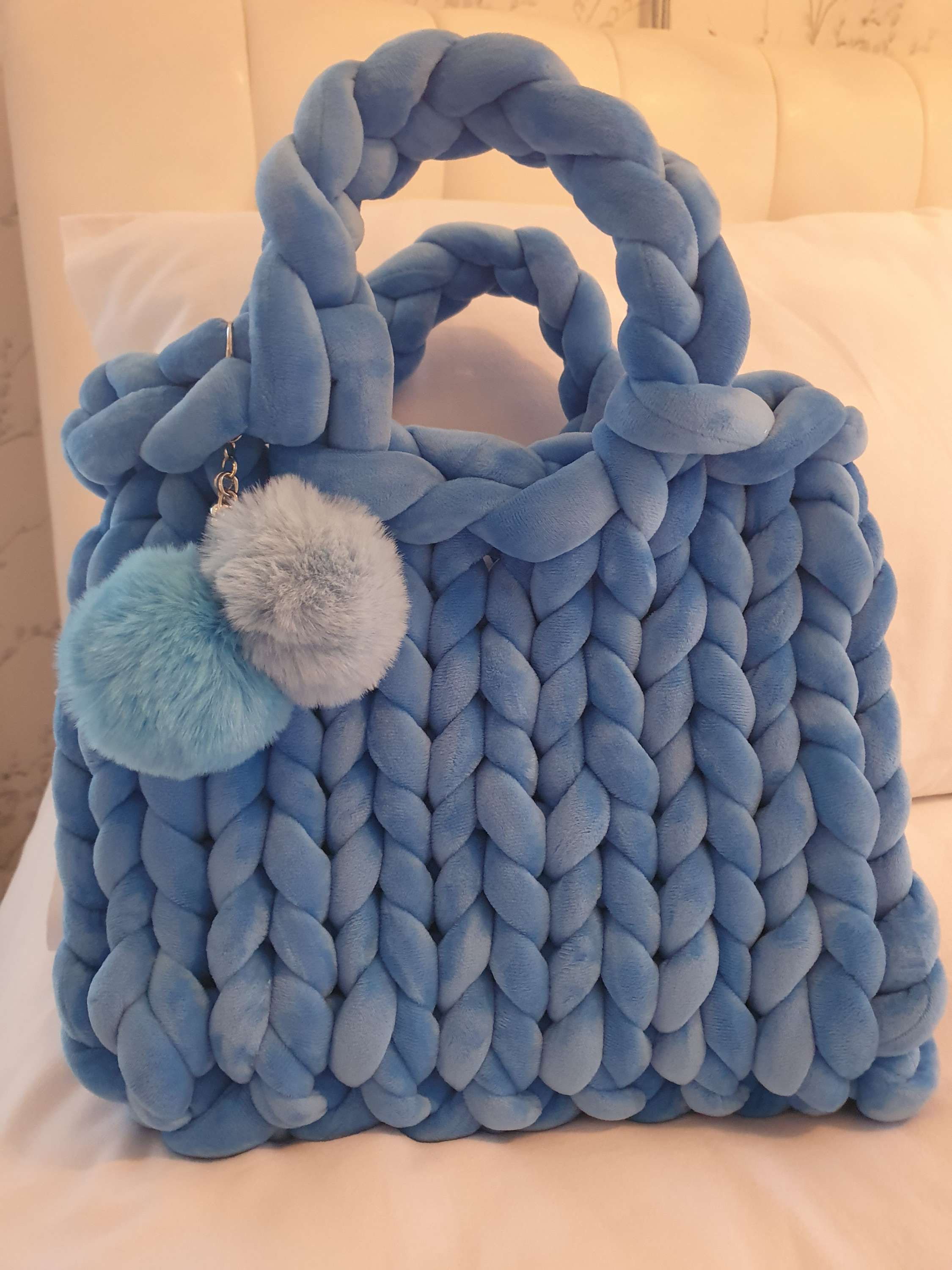 Stunning blue chunky knit handbag with pom poms