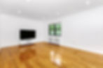 Renovated living room with new hardwood flooring