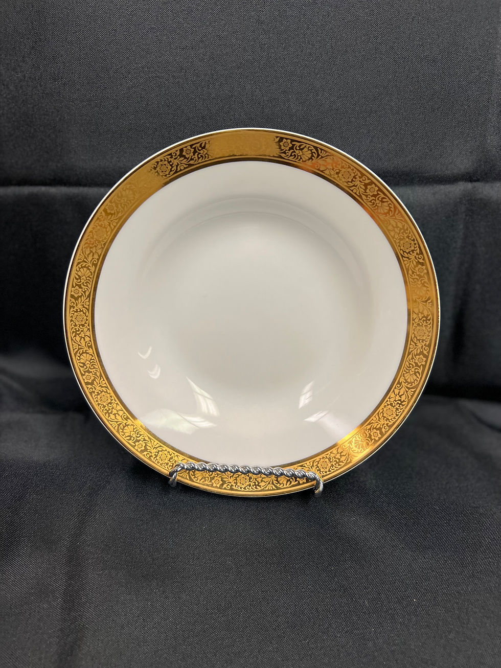 White and gold trim soup bowl