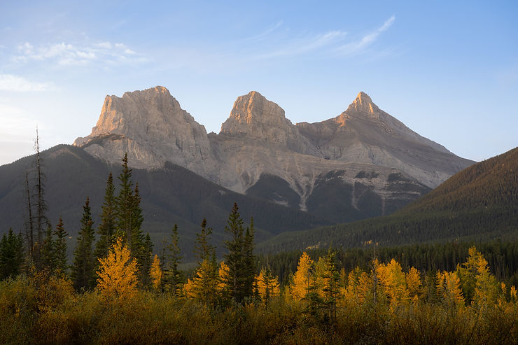 Three Sisters peaks at sunrise in Canmore, Alberta, Canada.