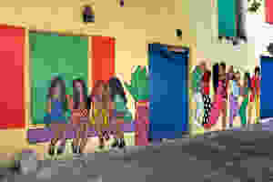 Colorful wall mural on a quiet city street of downtown Nassau, island of New Providence, The Bahamas.