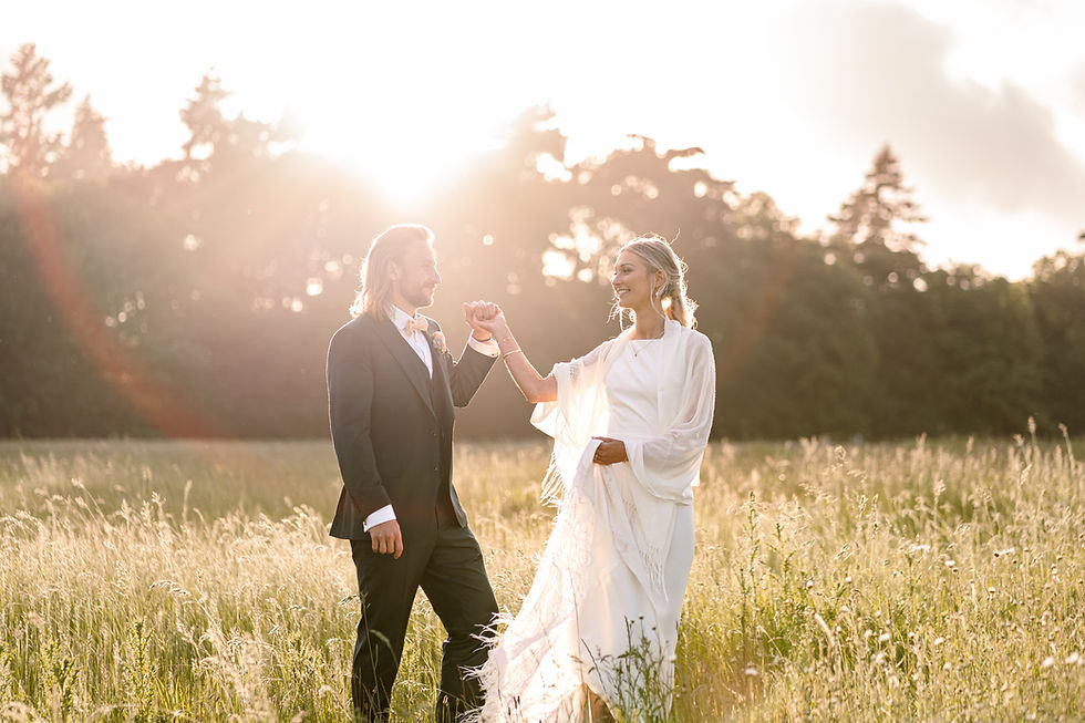 Golden June sunlight streaming through the trees at Blickling Hall after the ceremony.
