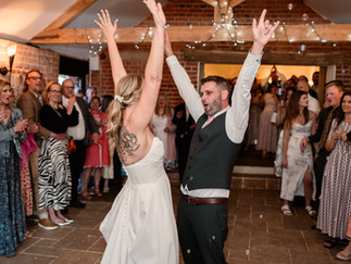 Sophie and Tom’s summer wedding at Hautbois Hall in Norfolk, filled with laughter, colourful confetti, a magician, and candid moments in the sunshine
