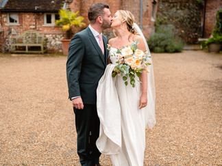 Sophie and Tom’s summer wedding at Hautbois Hall in Norfolk, filled with laughter, colourful confetti, a magician, and candid moments in the sunshine