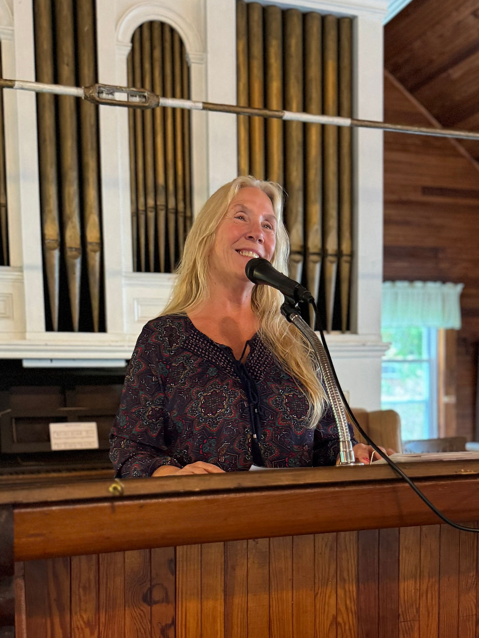 Alicia Parrish on the podium of TNSA giving a Sunday service