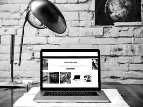 Black and White Website Homepage on Computer Screen