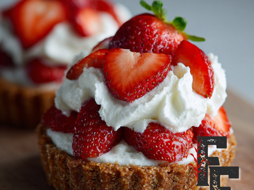 Protein tarts topped with whipped yogurt cream and fresh strawberries.