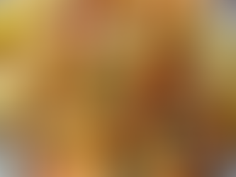 Grilled shrimp skewers brushed with garlic butter and garnished with parsley and lemon wedges.