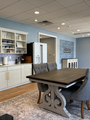 An extended view of Haven Women's Health front foyer, equipped with a comfortable seating area and boutique