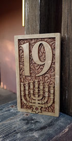 Engraved door number plaque made from Jerusalem stone