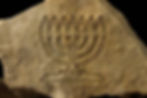 Menorah ornament crafted from raw Jerusalem stone for a meaningful Judaica gift.