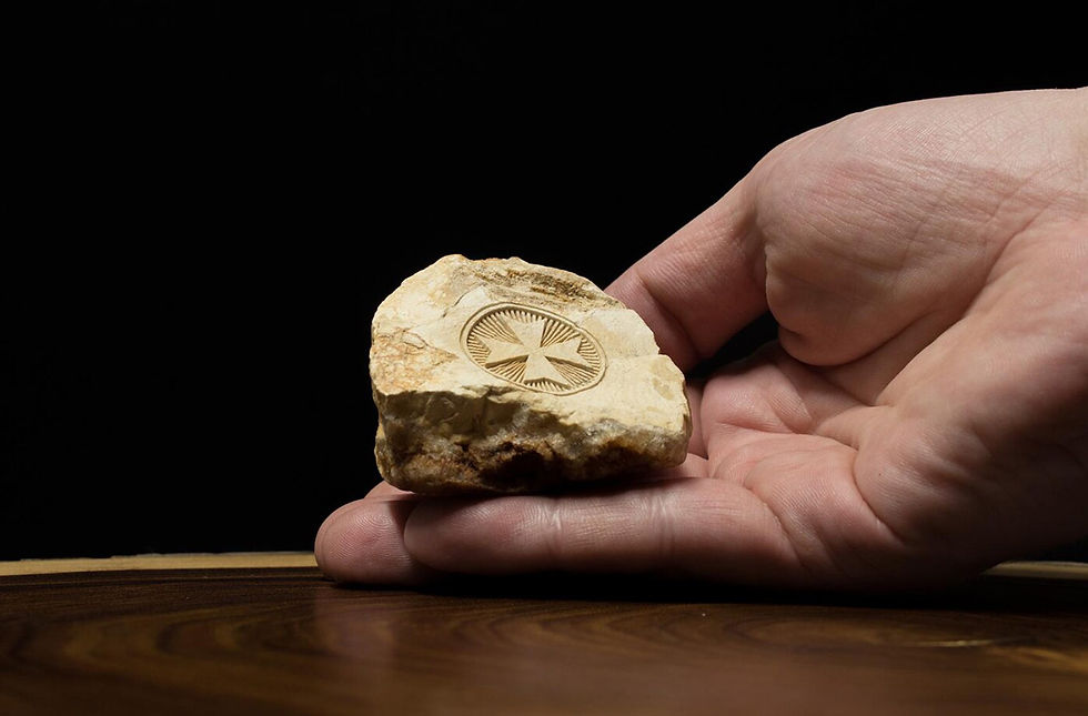 Thumbnail: Hand holding Jerusalem stone engraved with Maltese Cross