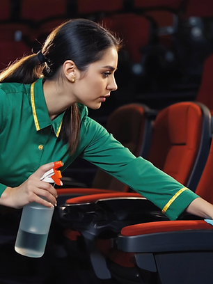 Gen4 Messy cinema theater in Prague, popcorn on seats and floor, empty soda cups, dim red 
