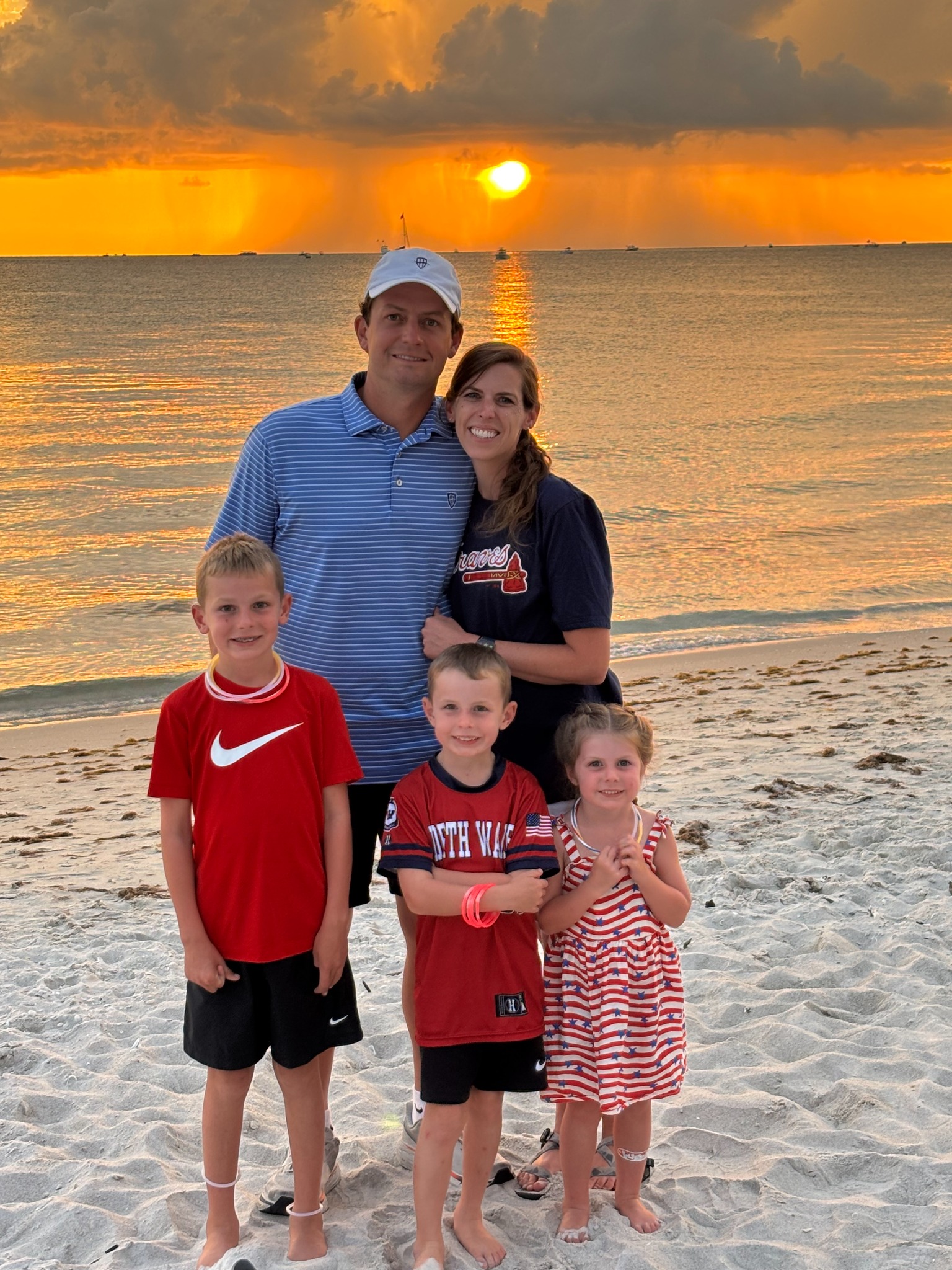 The Haddock family together at sunset on the beach