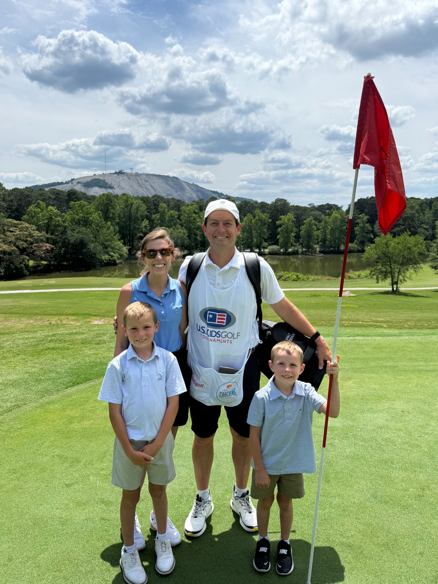 Scott and Brandi Haddock with their sons at a junior golf event