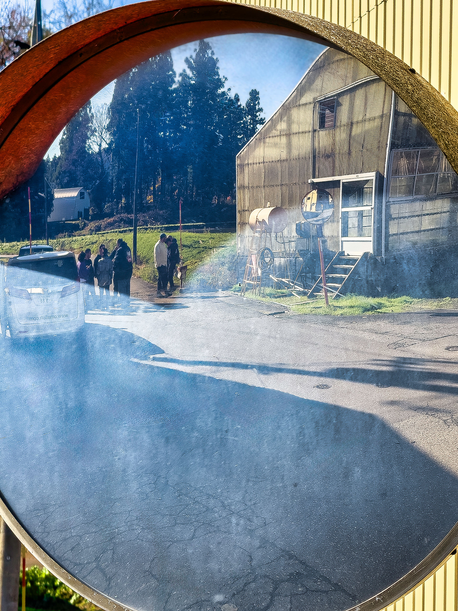 Koi Farm reflected in roadside mirror