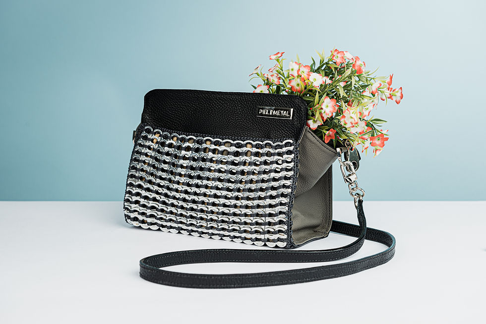 Ange black genuine leather handbag with a hand-crocheted recycled aluminum front pocket