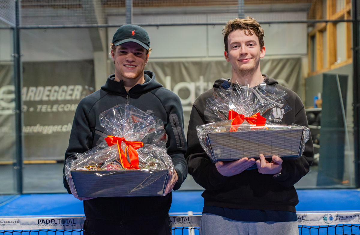 Two young men holding gifts after tournament, smiling happily, with text