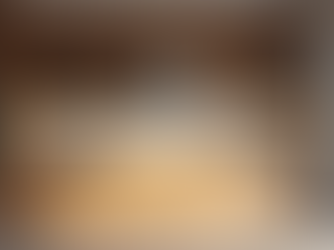 Modern modular kitchen design featuring light wood cabinetry, minimalist countertops, and warm under-cabinet lighting.