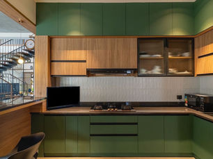 Modern modular kitchen design by Unison Interiors in Kottayam Kerala with premium finishes and smart storage