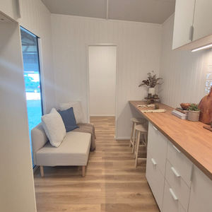 Two-bedroom single story custom tiny home kitchen and living 