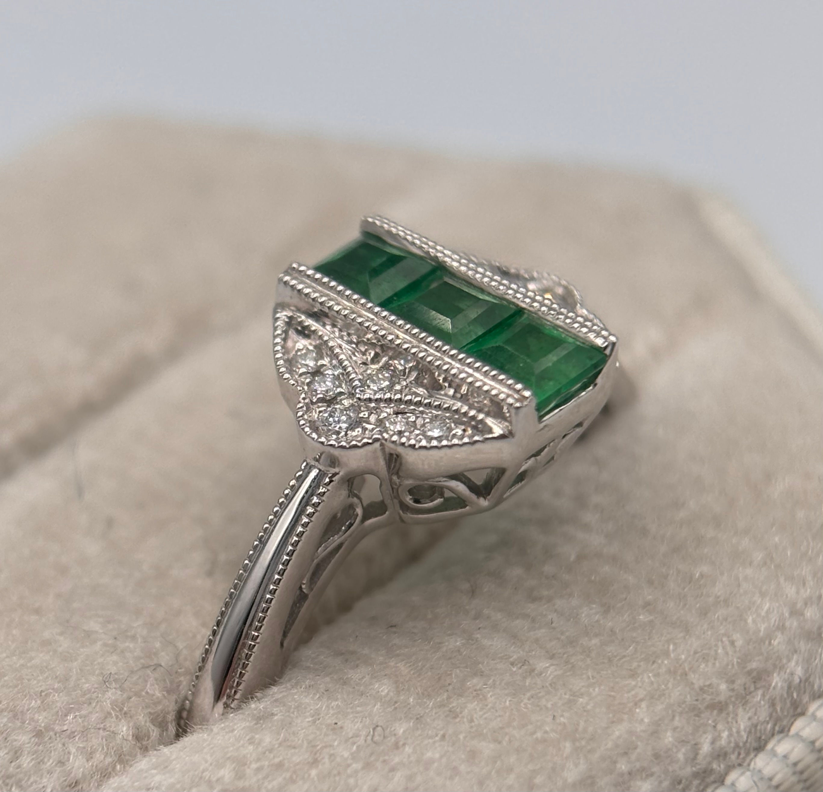 14KWG Emerald .049CTW Diamond .06CTW Ring