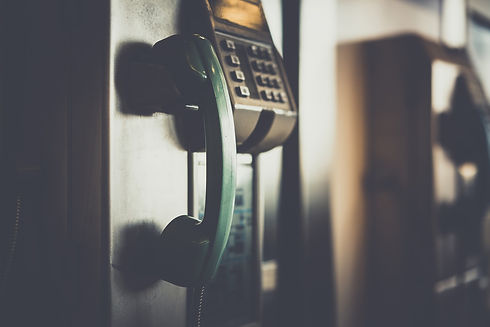 selective-focus-photo-of-green-telephone