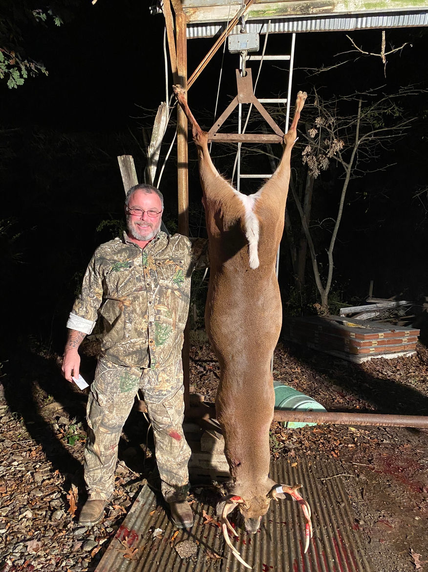 Hunter with buck deer in DeWitt, Arkansas