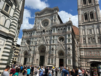 The Duomo, officially the Cathedral di Santa Maria del Fiore, is the main cathedral of Florence and a masterpiece of Gothic and Renaissance architecture. The cathedral complex includes the main cathedral, Brunelleschi's dome, Giotto's Bell Tower, and the Baptistery.