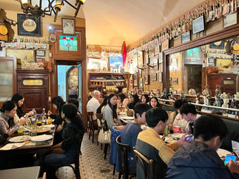 Experience an authentic bouchon lyonnais (such as Chez Chabert et fils), a traditional, rustic restaurant in Lyon, known for serving hearty, homemade local specialties in a convivial, intimate atmosphere. They typically feature checkered tablecloths, wood interiors, walls filled with local memorabilia or vintage photos and a focus on pork dishes, offal (edible internal organs) and local wine. Only about 20–25 locations hold the official “Les Bouchons Lyonnais” accreditation.