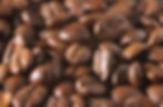 Freshly roasted Colombian coffee beans ready for grinding
