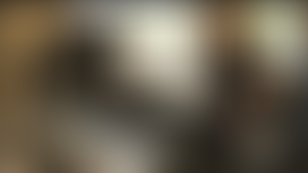 911 dispatcher working comfortably during Telecommunicators Week at a control room workstation, highlighting stacked monitors with both rows of bezels positioned at eye level to prevent neck strain